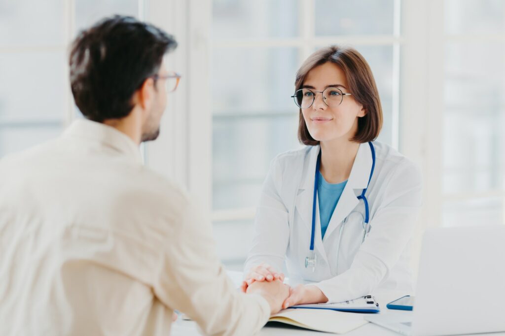 Male patient has consultation with female doctor, receives support